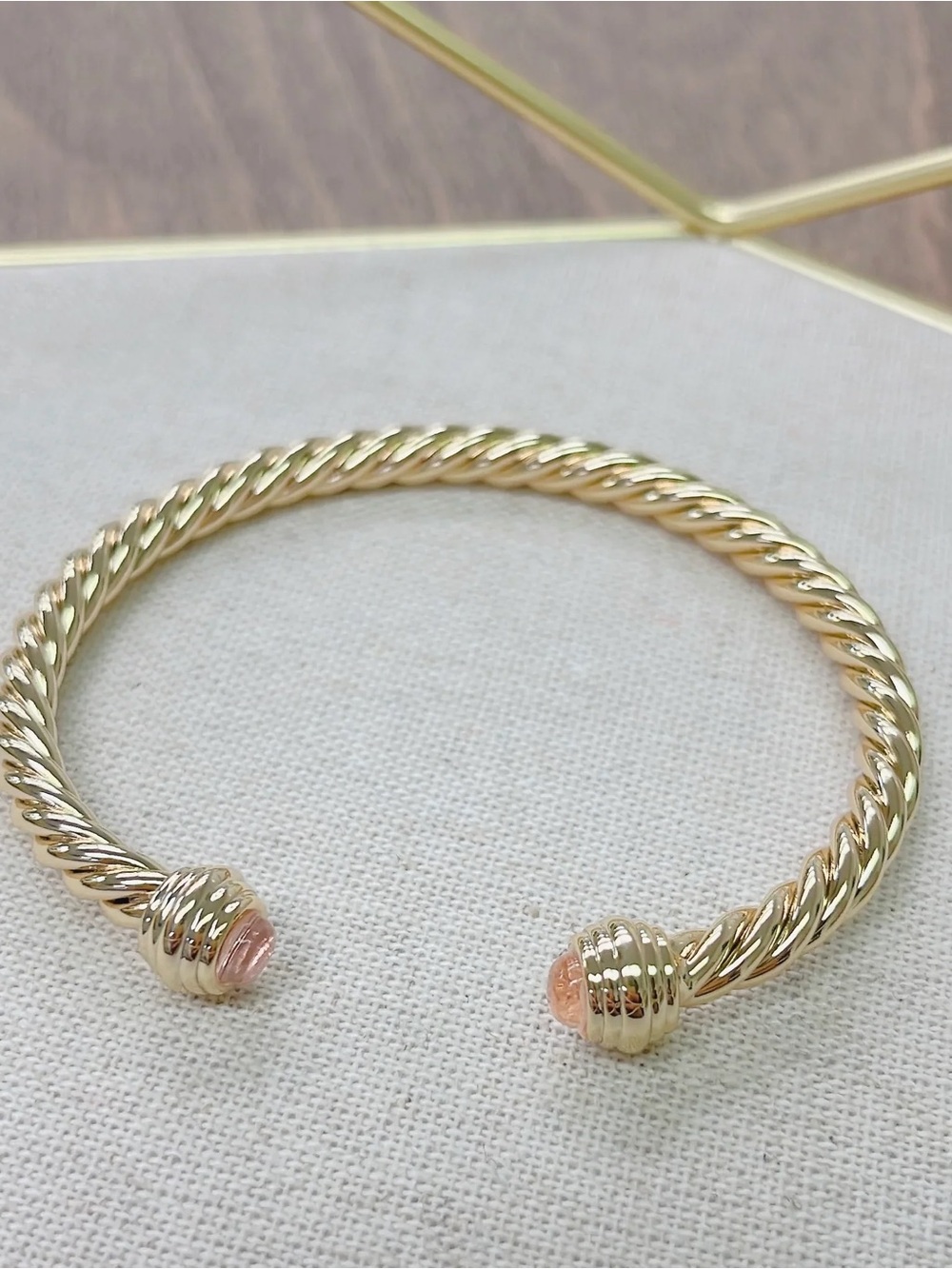 Gold-Tone Twisted Open Cuff Bracelet with Pink Accent Ends